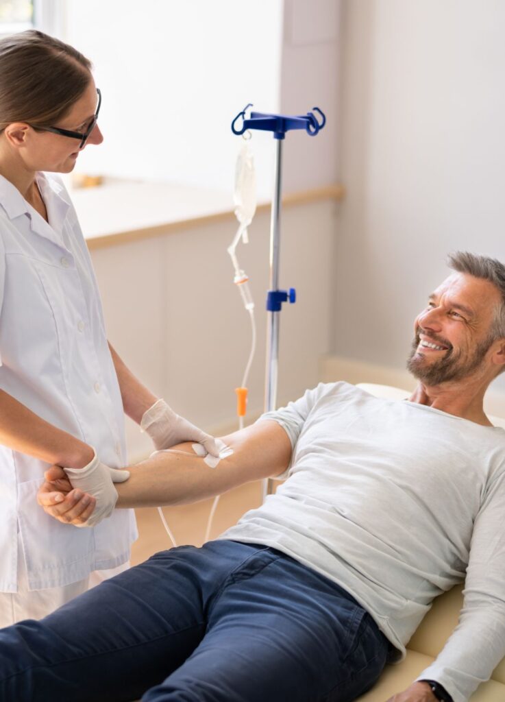 Nurse administering mobile vitamin IV drip therapy in Baker Street - W1
